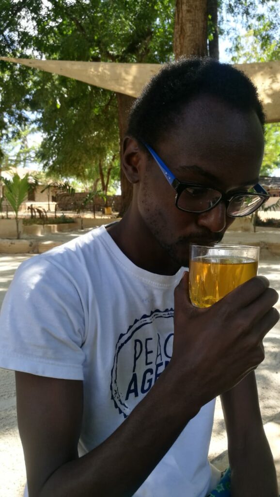 boy drinking neem