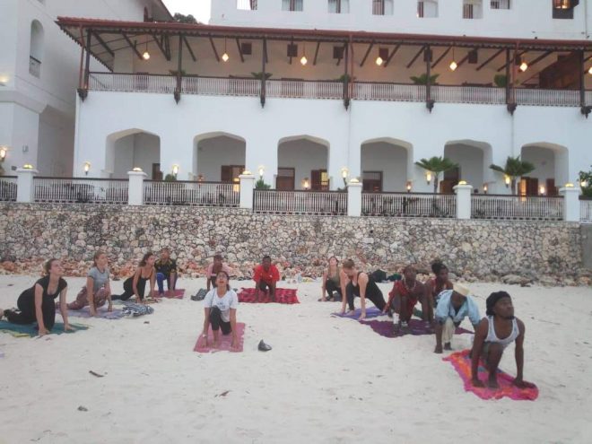 narissa child of the earth teaching beach yoga in Zanzibar